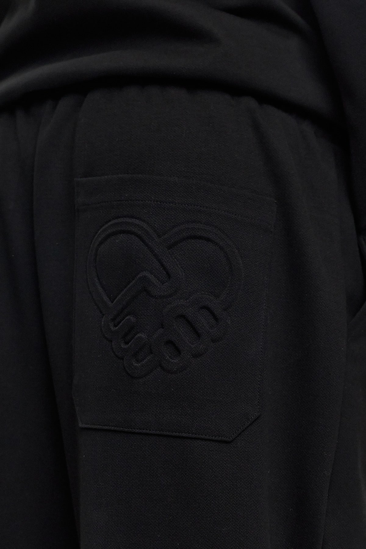 HIKARI Embossed Logo Sweatpants – Black